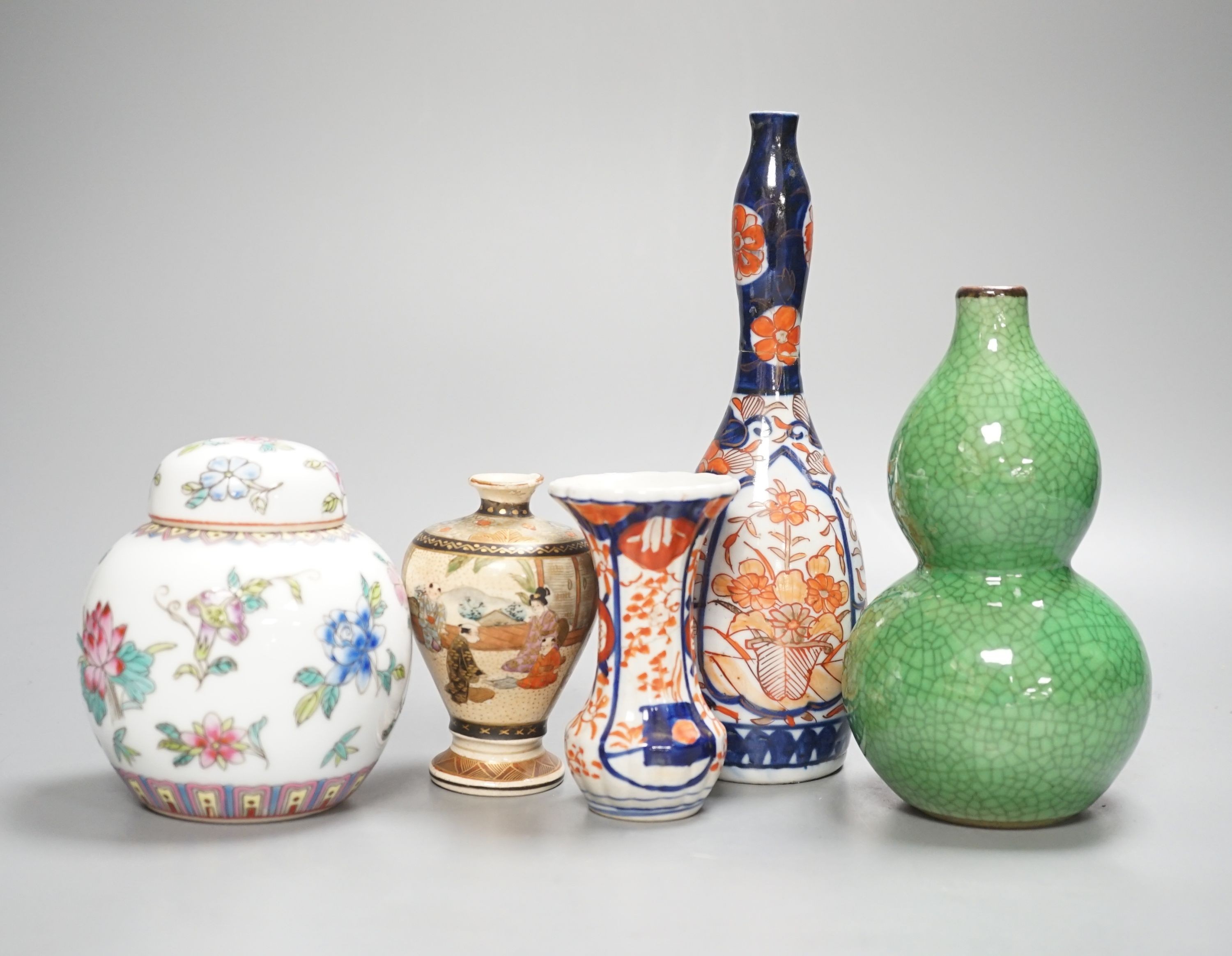 A Chinese green double gourd crackleware vase, a famille rose jar and cover and two Japanese vases, tallest 19.5cm (5)